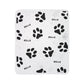 White blanket with black paw prints and &