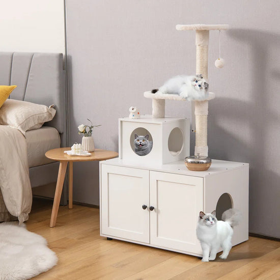 White cat tree with a cat sitting on top in a living room setting.