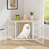 White dog inside a pet crate in a room with a wooden floor and a window.