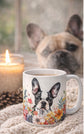Mug with a dog design featuring a French Bulldog, next to a lit candle and a dog in the background.